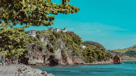 Rio de Janeiro, Brazil - CIRCA 2021: Coastal region of ocean beach during the day with sea, sand and rocksのeditorial素材