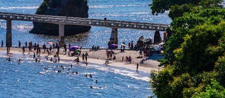 Rio de Janeiro, Brazil - CIRCA 2021: Coastal region of ocean beach during the day with sea, sand and rocksのeditorial素材