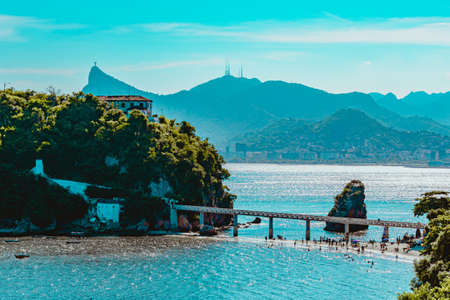 Rio de Janeiro, Brazil - CIRCA 2021: Coastal region of ocean beach during the day with sea, sand and rocksのeditorial素材