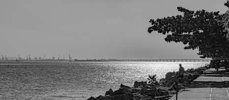 Rio de Janeiro, Brazil - CIRCA 2021: Coastal region of ocean beach during the day with sea, sand and rocksのeditorial素材