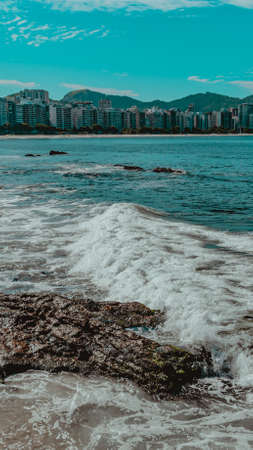 Rio de Janeiro, Brazil - CIRCA 2021: Coastal region of ocean beach during the day with sea, sand and rocksのeditorial素材