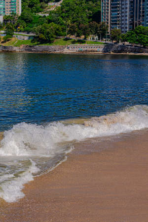 Rio de Janeiro, Brazil - CIRCA 2021: Coastal region of ocean beach during the day with sea, sand and rocksのeditorial素材