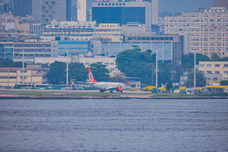 Rio de Janeiro, Brazil - CIRCA 2020: Brazilian commercial plane taxiing on the runway at Santos...