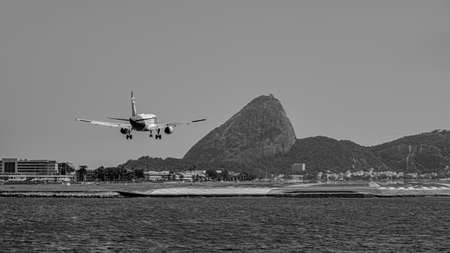 Rio de Janeiro, Brazil - CIRCA 2020: Commercial plane landing on the runway at Santos Dumont...