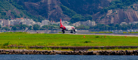 Rio de Janeiro, Brazil - CIRCA 2020: Brazilian commercial plane taxiing on the runway at Santos...