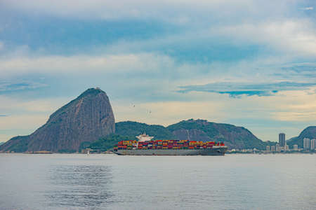 Rio de Janeiro, Brazil - CIRCA 2021: Photo of Sugarloaf Mountain, Sugarloaf Mountain, with a cargo...