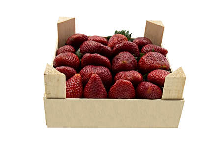 Large red strawberry in a white wooden box on a light backgroundの写真素材