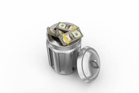 Currency note in trash binの写真素材
