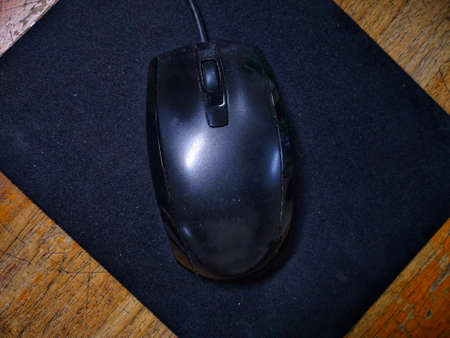 photo of mouse and computer device on work deskの写真素材