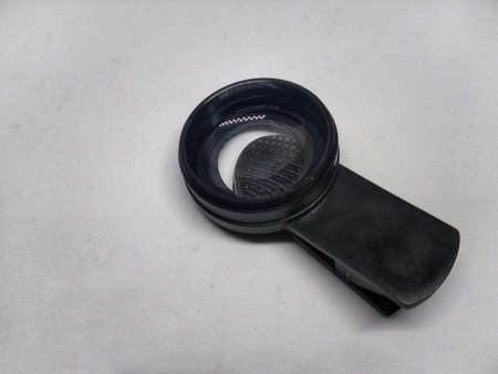 photo of cellphone camera lens on a white backgroundの写真素材
