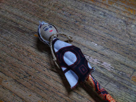 photo of a pencil in the shape of a doll on the tableの写真素材