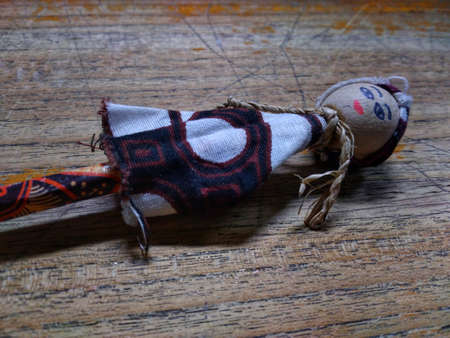 photo of a pencil in the shape of a doll on the tableの写真素材