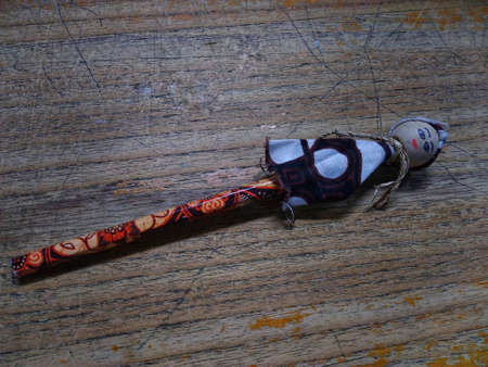 photo of a pencil in the shape of a doll on the tableの写真素材