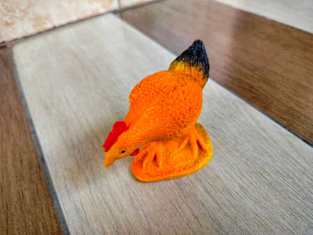Photo of a cute orange chicken toyの写真素材