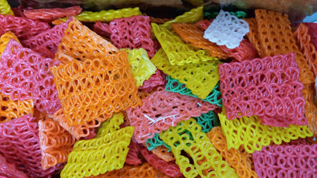 Photo of colorful, rectangular shaped raw crackers used as editing backgroundの写真素材