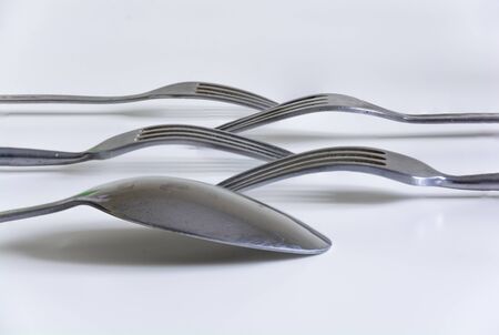 Spoon and forks lined up