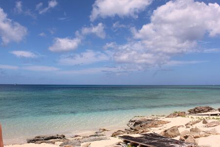 Peaceful seascape of Turquoise water and Rocky Shore in Turks and Caicosの写真素材
