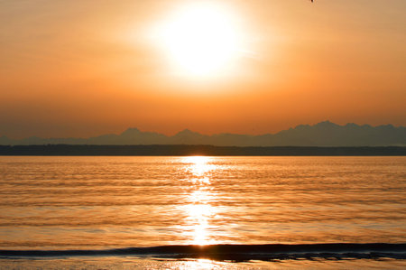 Sunset over waterの写真素材