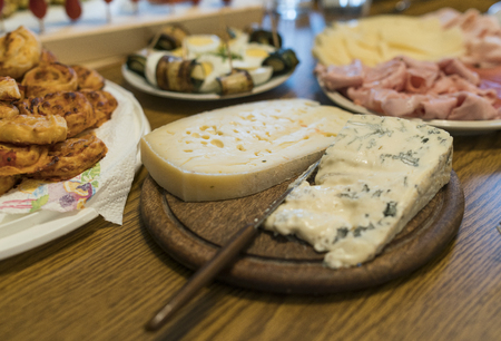 Various cheese on wood plateの写真素材
