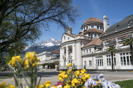 Kurhaus Meran surrounded by flowers in springのeditorial素材