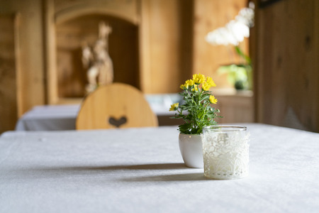 empty table with no decoration in a traditional Tyrolean mountain restaurant in austriaの写真素材