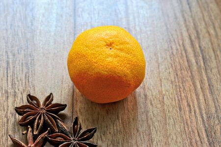 Tangerine and anise on a wooden tableの写真素材