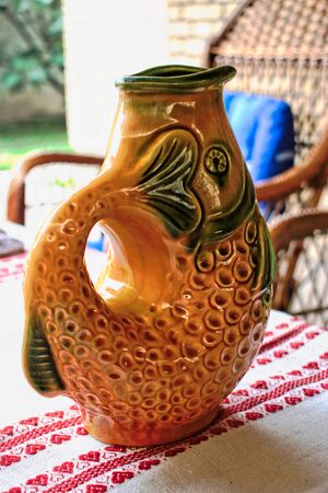 Fish shaped water pitcher on a tableの写真素材