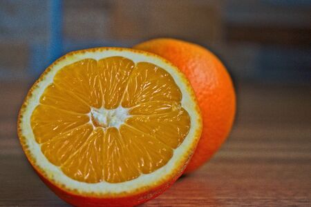 Closeup of oranges on a wooden tableの写真素材