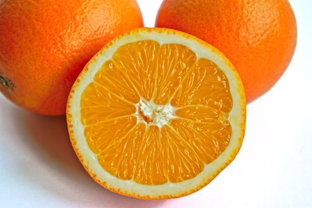 Closeup of oranges on a white backgroundの写真素材