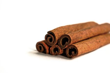 Closeup of cinnamon sticks on a white backgroundの写真素材