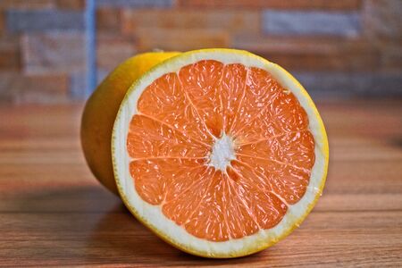 Closeup of grapefruits on a wooden tableの写真素材