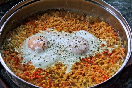 Closeup of two fried eggs on riceの写真素材
