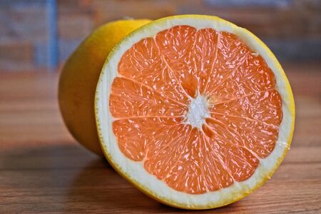 Closeup of grapefruits on a wooden tableの写真素材