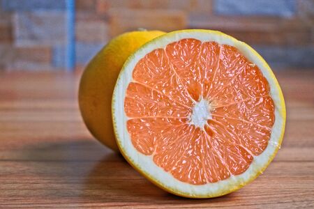 Closeup of grapefruits on a wooden tableの写真素材