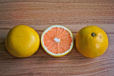 Closeup of grapefruits on a wooden tableの写真素材
