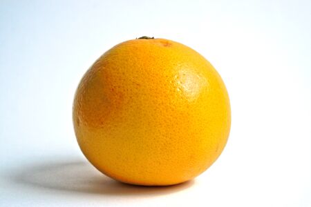 Yellow grapefruit on a white backgroundの写真素材
