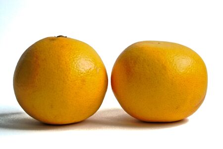 Two grapefruits on a white backgroundの写真素材