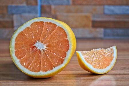 Closeup of grapefruits on a wooden tableの写真素材