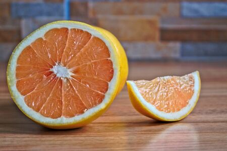 Closeup of grapefruits on a wooden tableの写真素材