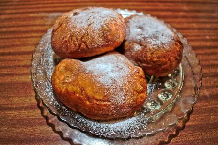 Homemade donuts on a wooden tableの写真素材
