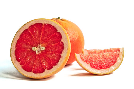 Closeup of red grapefruits on a white backgroundの写真素材