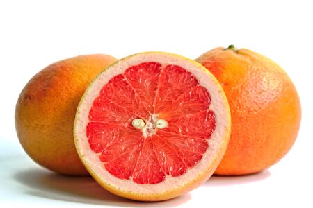 Closeup of red grapefruits on a white backgroundの写真素材