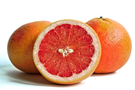 Closeup of red grapefruits on a white backgroundの写真素材