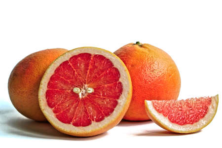 Closeup of red grapefruits on a white backgroundの写真素材