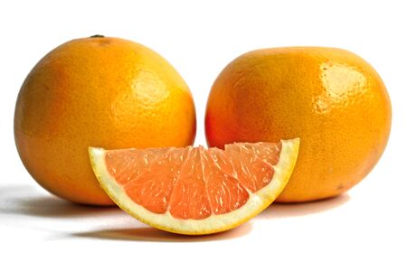 Closeup of yellow grapefruits on a white backgroundの写真素材