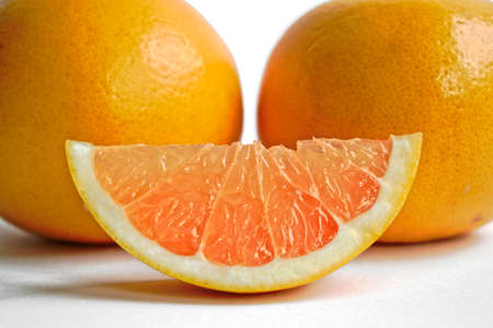 Closeup of yellow grapefruits on a white backgroundの写真素材