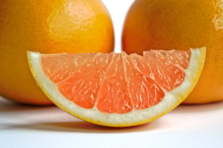 Closeup of yellow grapefruits on a white backgroundの写真素材