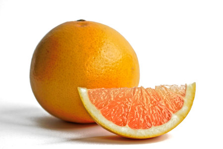 Closeup of yellow grapefruits on a white backgroundの写真素材