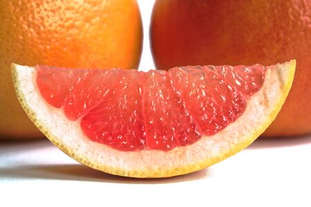 Closeup of red grapefruits on a white backgroundの写真素材