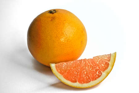 Closeup of yellow grapefruits on a white backgroundの写真素材